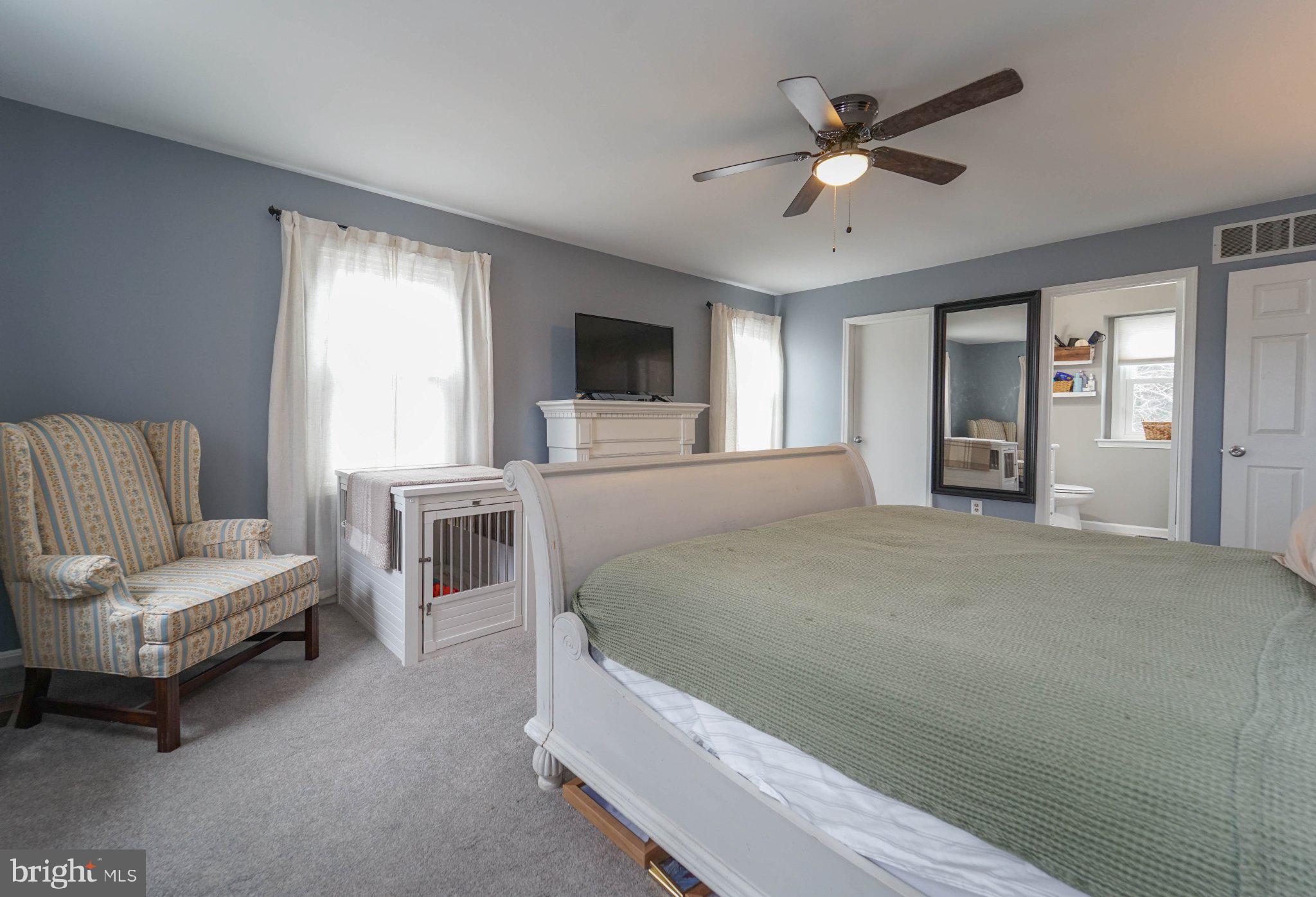 211 Queen Anne Road Stevensville, MD 21666 - Photo 30 of 33 Serene bedroom with soft hues.