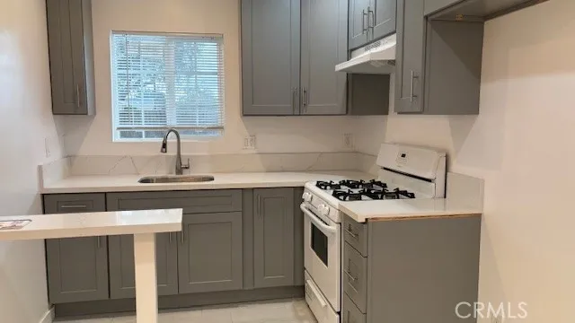 a close view of a stove a microwave and cabinets