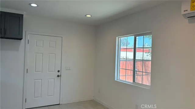 a kitchen with a sink cabinets and window