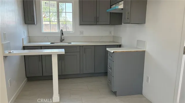 a view of a kitchen with a sink