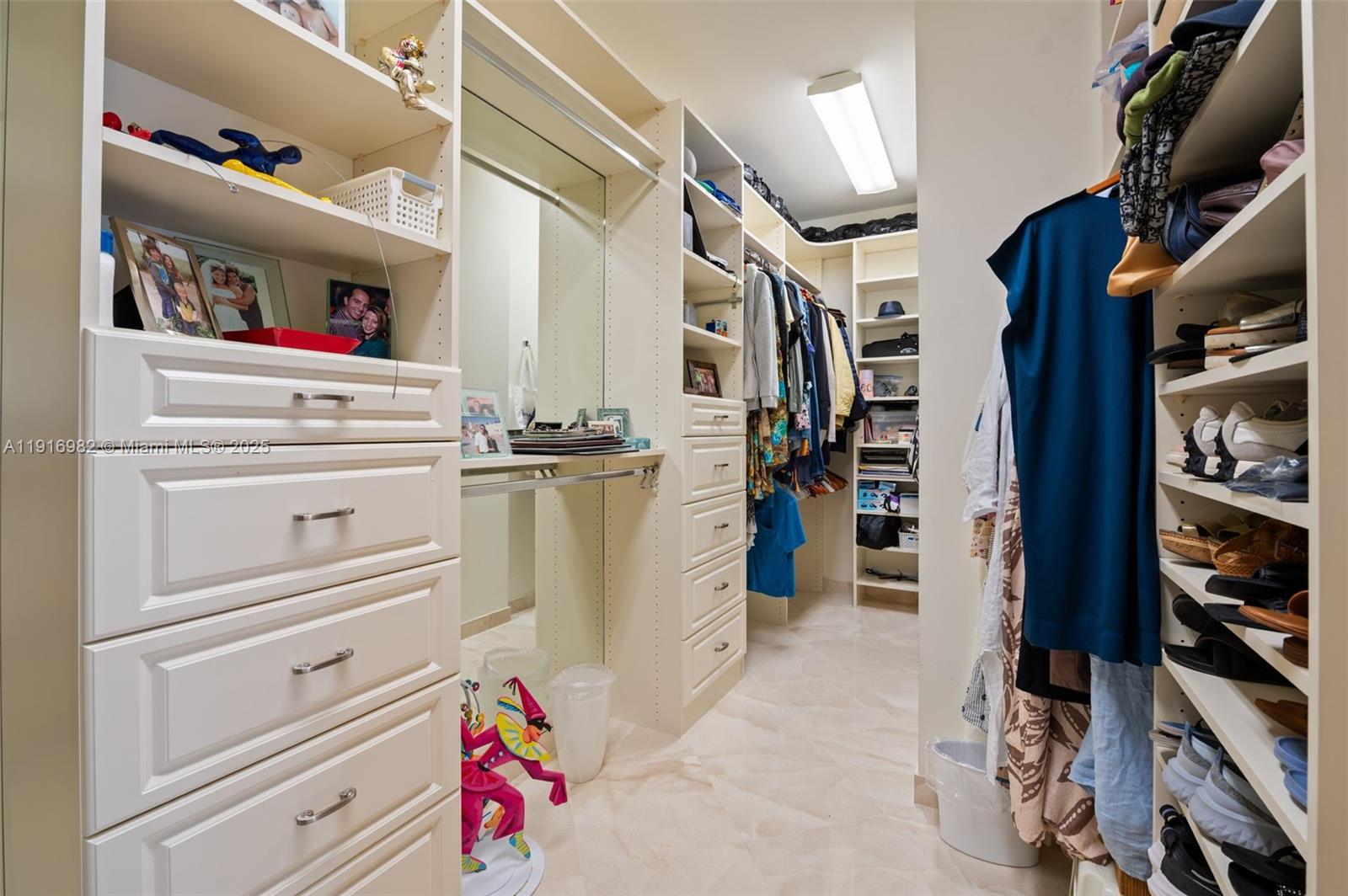 9595 Collins Avenue, Unit N8A Surfside, FL 33154 - Photo 14 of 25 a view of walk in closet with clothes and shoes