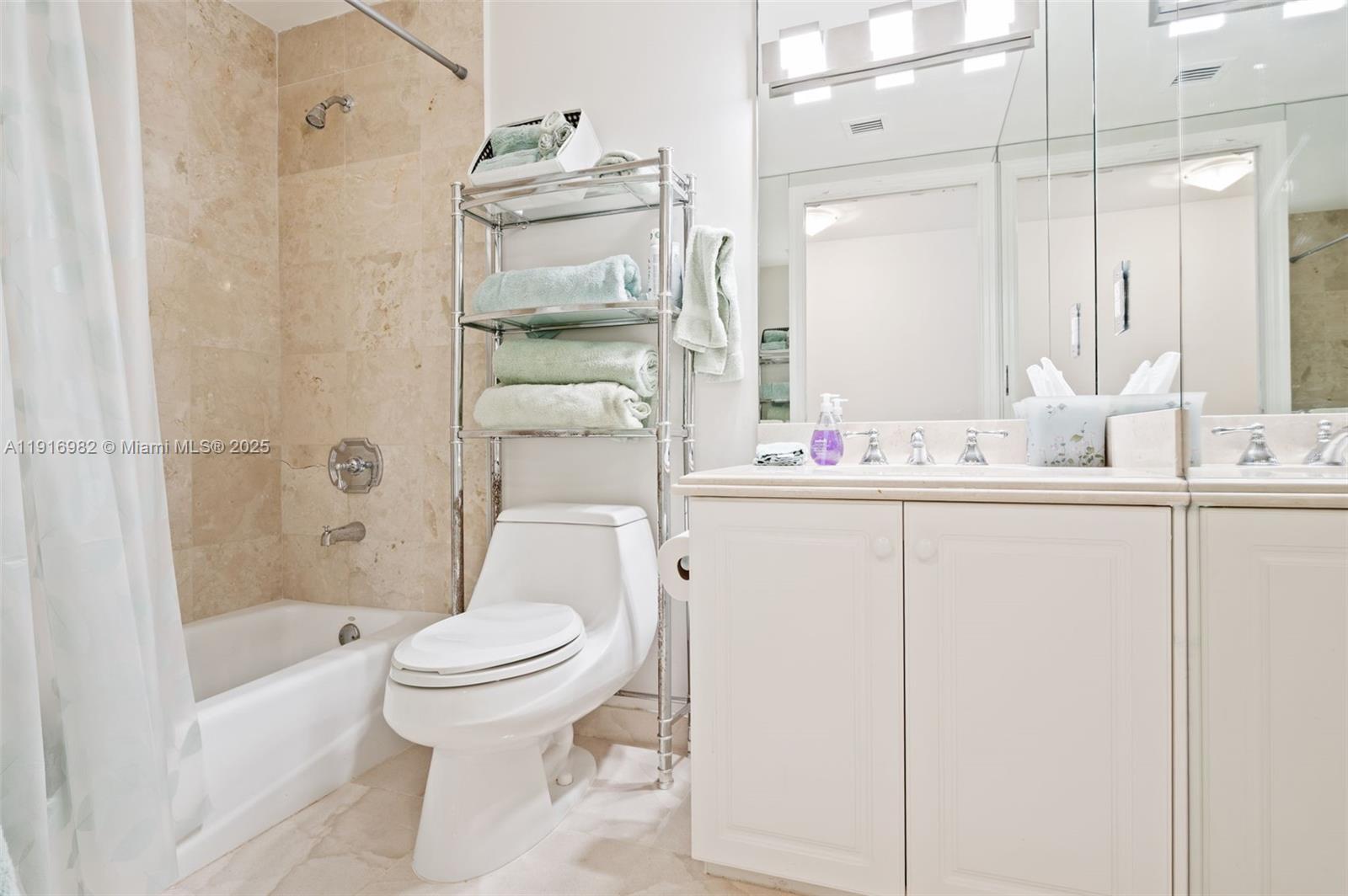 9595 Collins Avenue, Unit N8A Surfside, FL 33154 - Photo 21 of 25 a bathroom with a sink toilet and shower