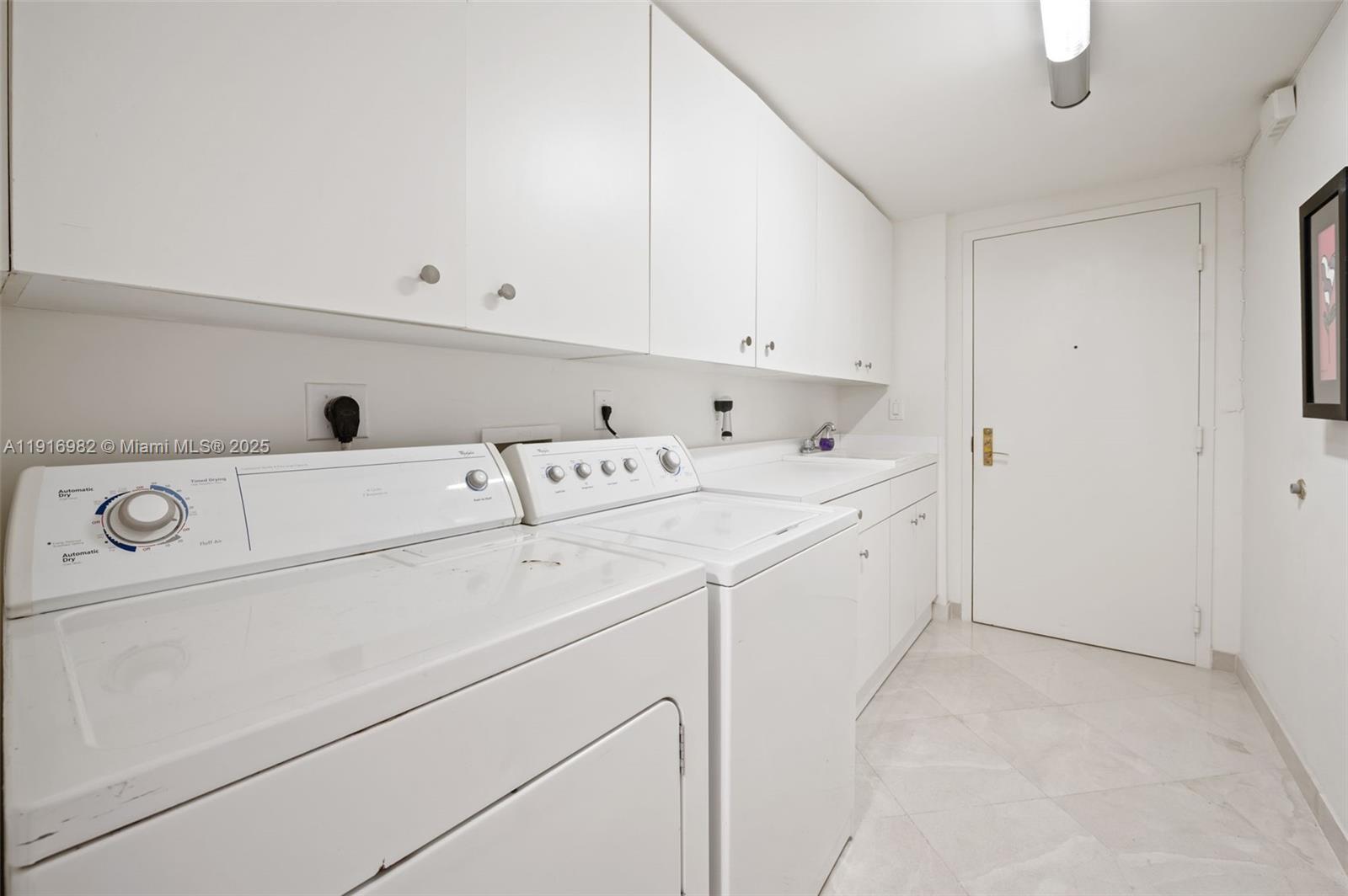 9595 Collins Avenue, Unit N8A Surfside, FL 33154 - Photo 22 of 25 a utility room with dryer and washer