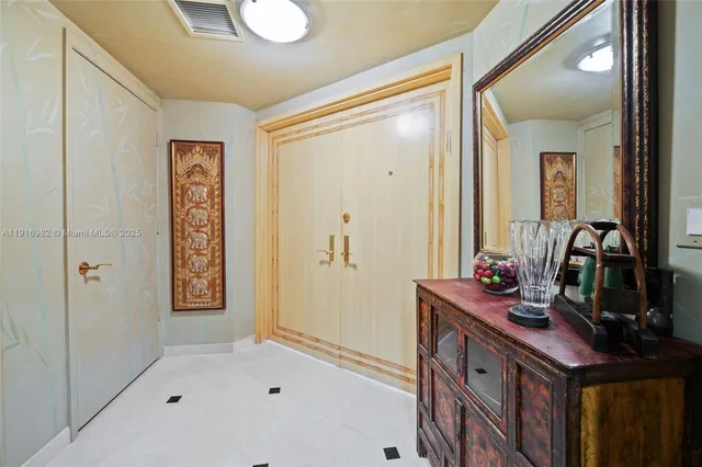 a bathroom with a sink a mirror and a shower