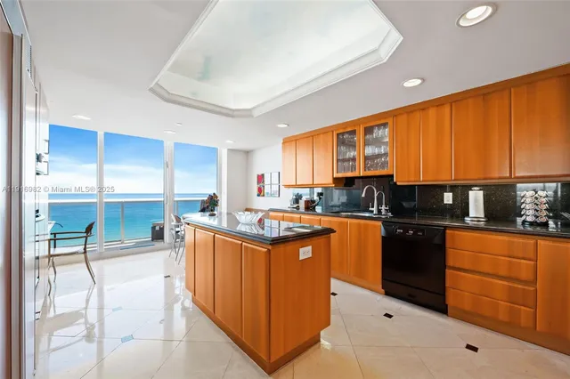 a kitchen with stainless steel appliances granite countertop a stove and cabinets