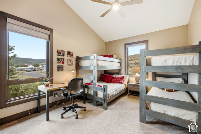 1130 Pace Road Park City, UT 84098 - Photo 43 of 73 Vaulted ceiling, two bunk bed structures, built-in desk, large window with roller shade, and ceiling fan