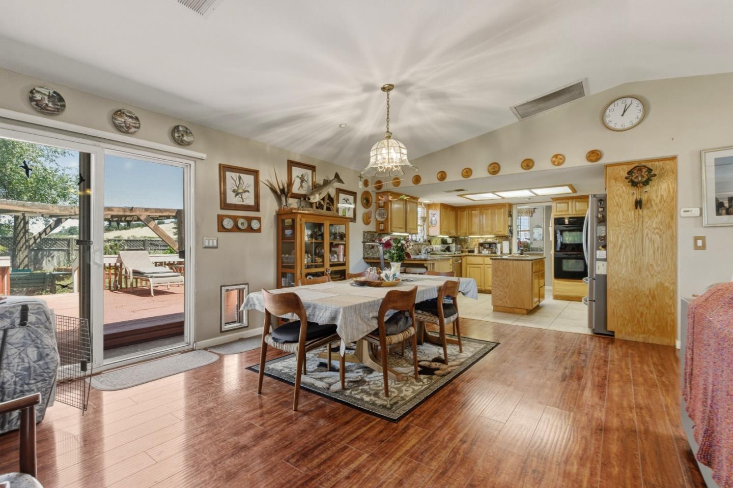 38780 Dinosaur Point Road Hollister, CA 95023 - Photo 5 of 34 a living room with dining room and wooden floor