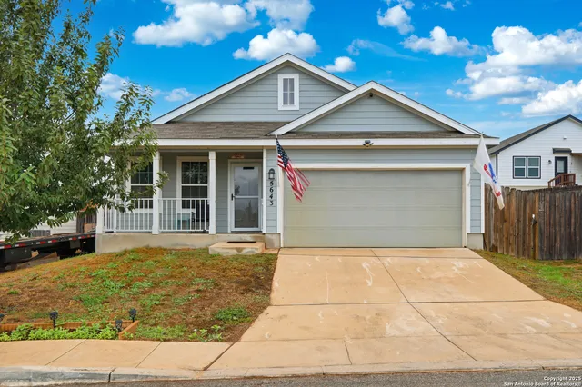 a front view of a house with a garage