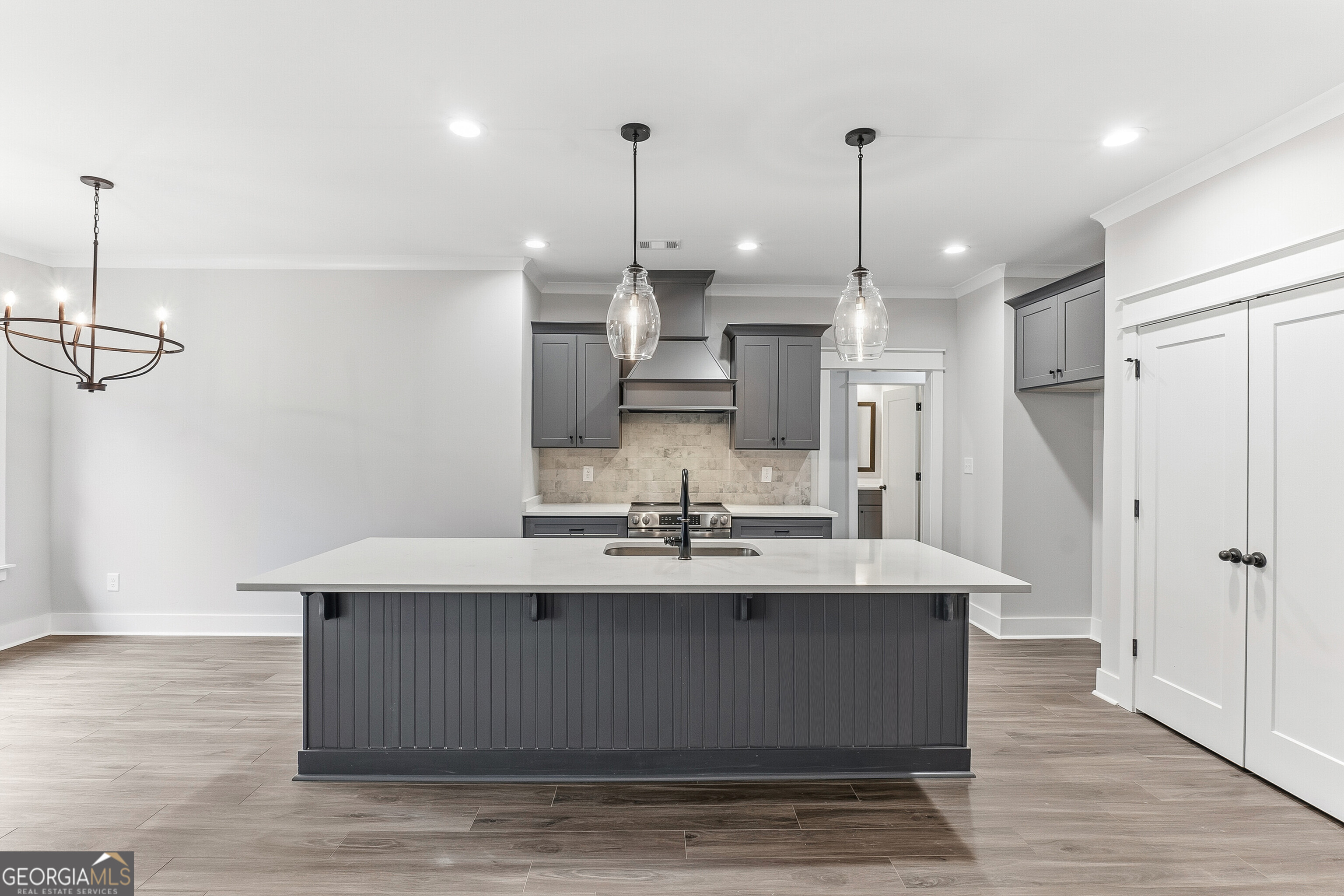 606 Bristleleaf Path Kathleen, GA 31047 - Photo 12 of 48 a view of a kitchen with kitchen island stainless steel appliances sink and wooden floor