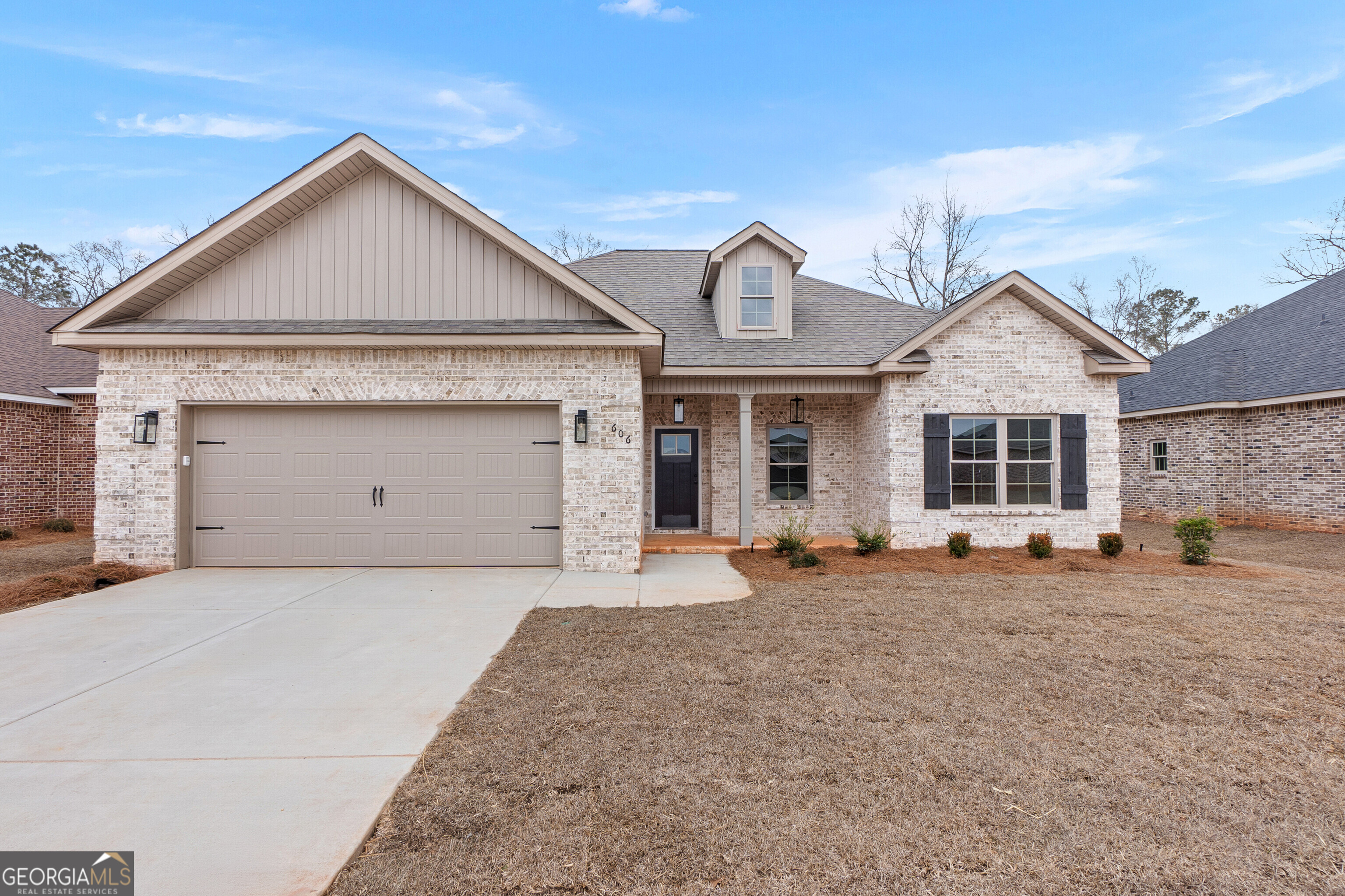 606 Bristleleaf Path Kathleen, GA 31047 - Photo 2 of 48 a front view of a house with a yard and garage