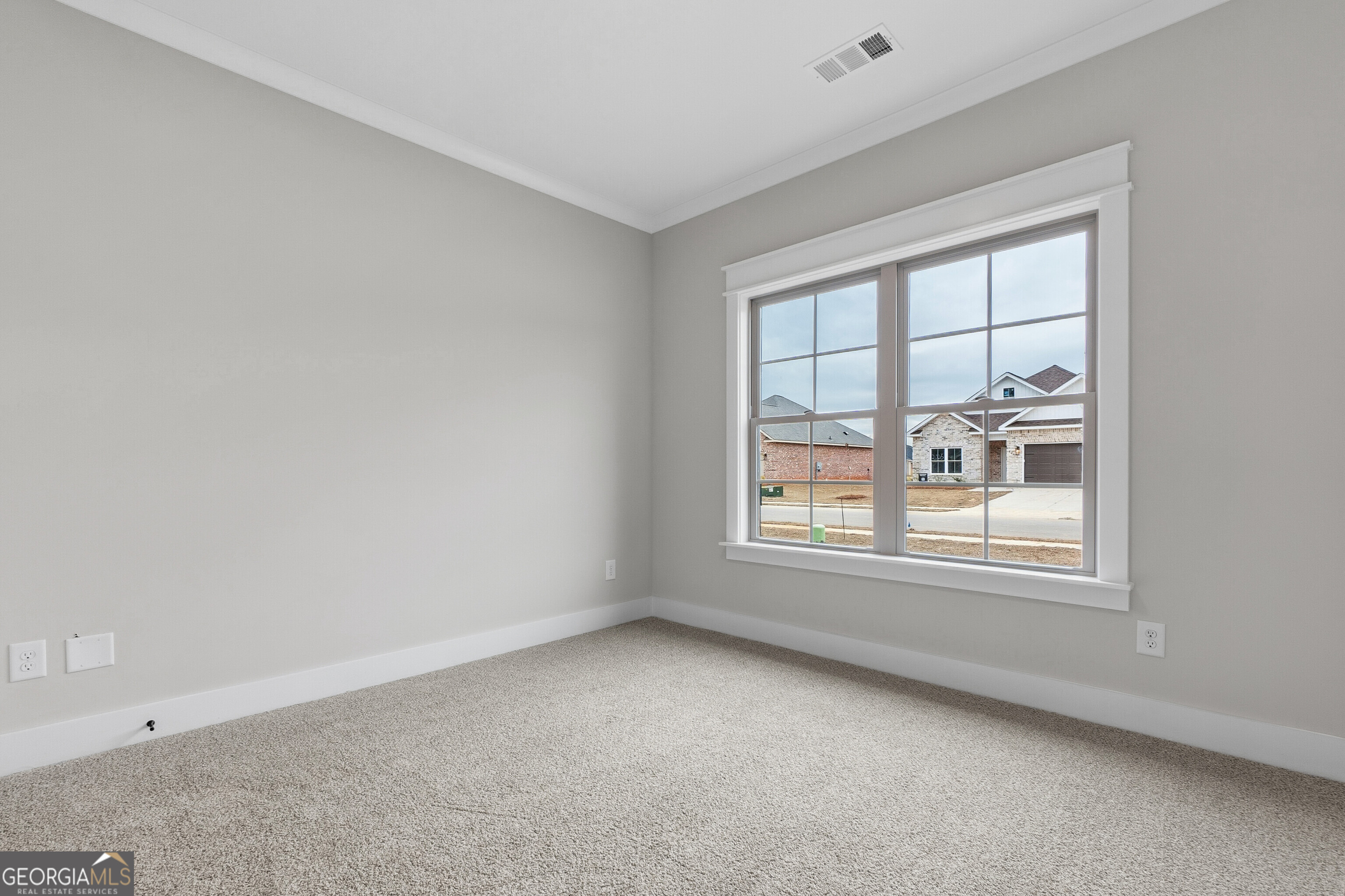 606 Bristleleaf Path Kathleen, GA 31047 - Photo 36 of 48 an empty room with a window