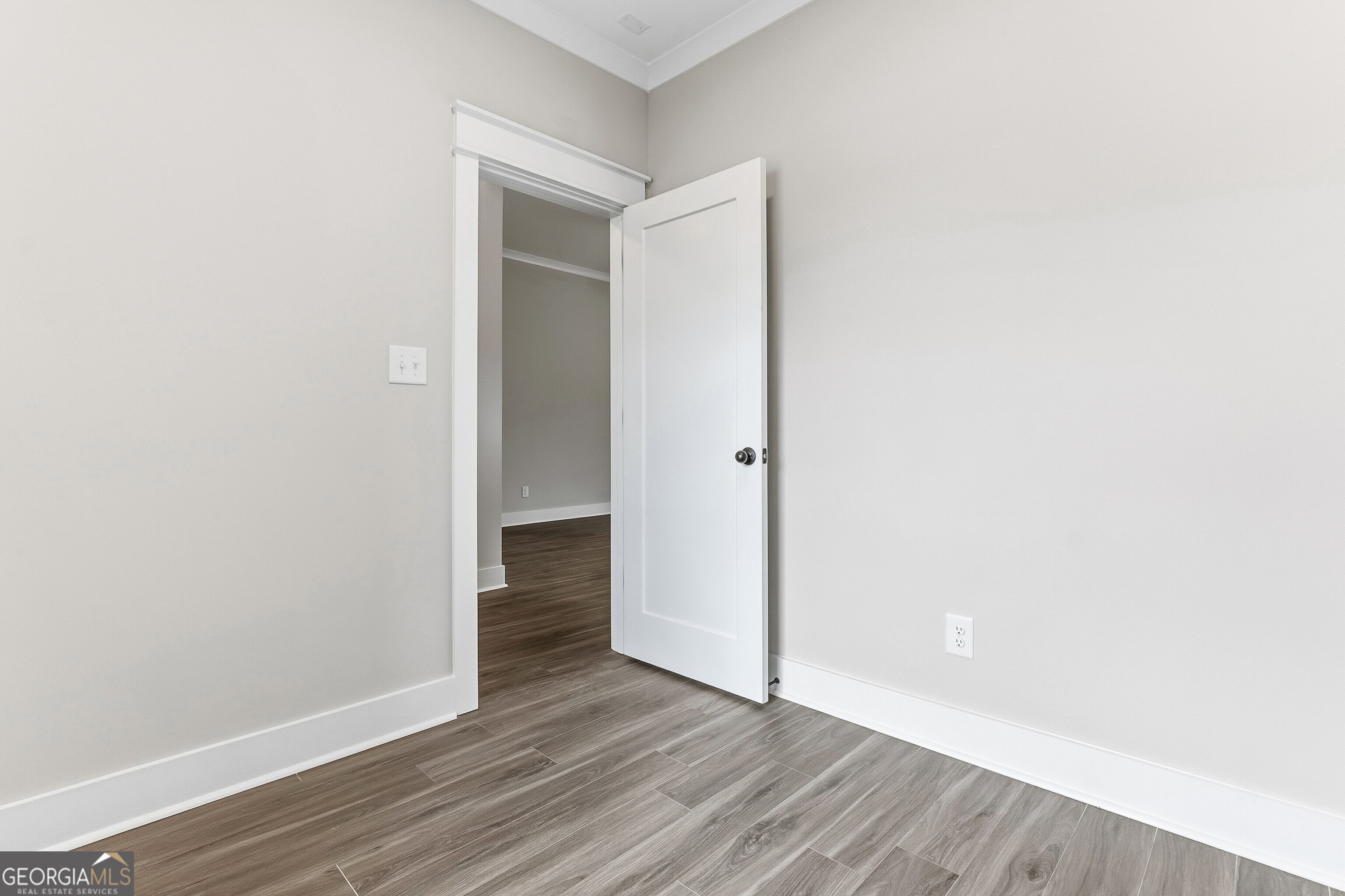 606 Bristleleaf Path Kathleen, GA 31047 - Photo 7 of 48 a view of an empty room with wooden floor