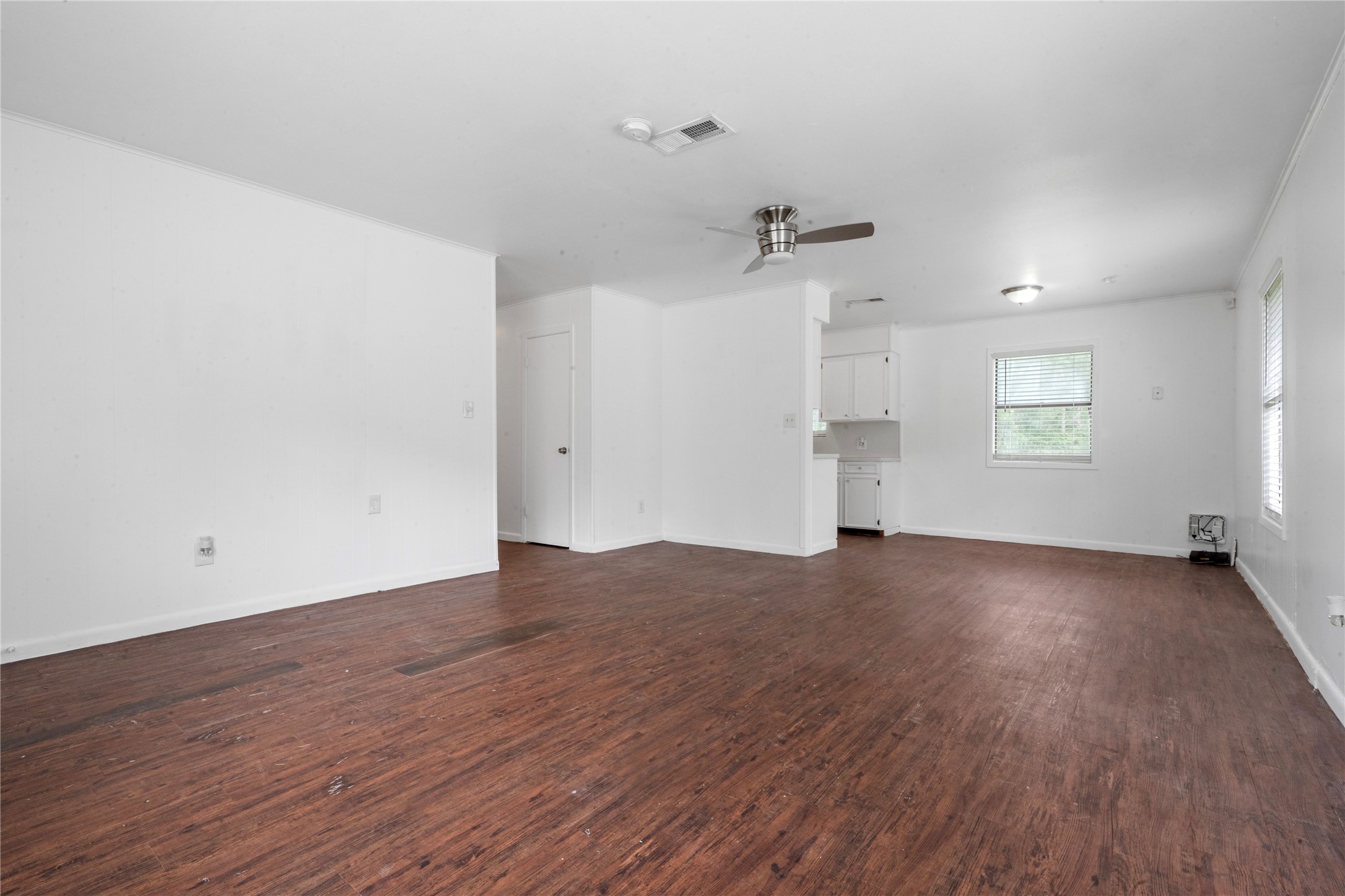 139 Holly Ridge Onalaska, TX 77360 - Photo 19 of 23 an empty room with wooden floor and windows