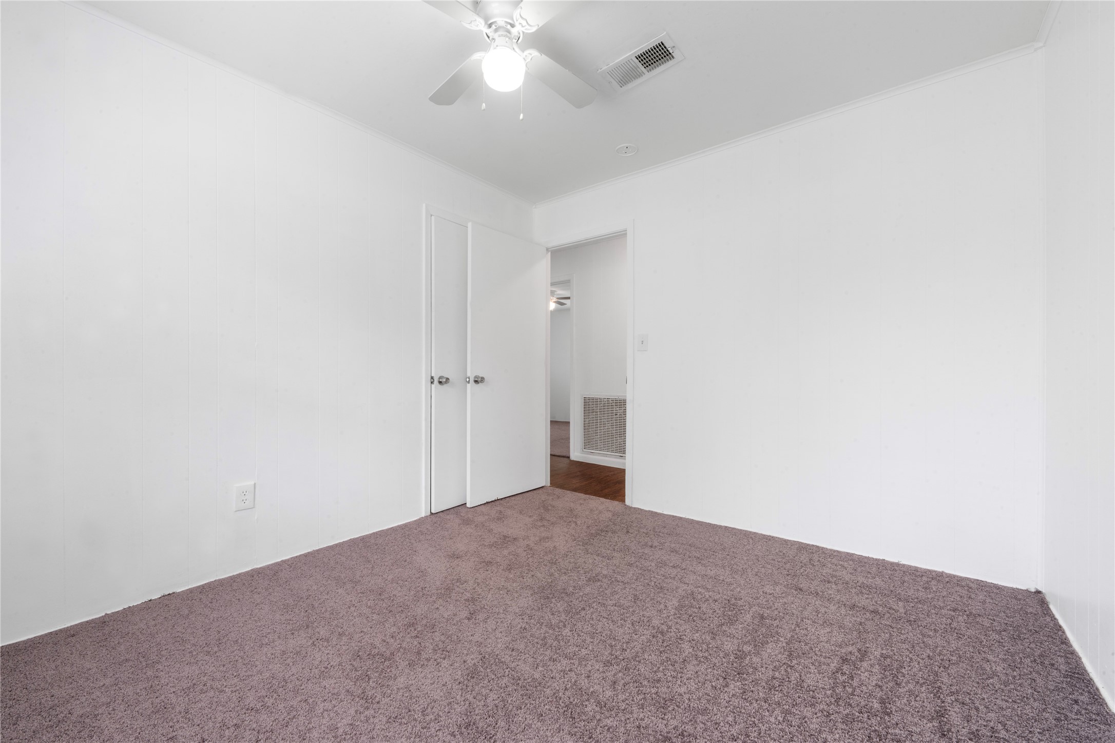 139 Holly Ridge Onalaska, TX 77360 - Photo 7 of 23 an empty room with a ceiling fan and carpet