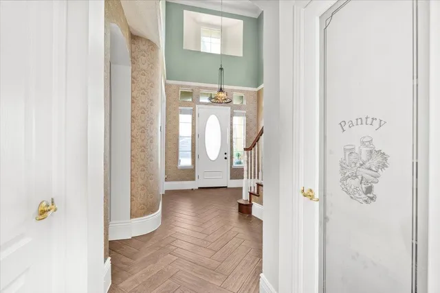 a view of a hallway view with wooden floor and staircase
