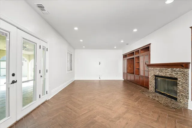 a view of an empty room with a fireplace