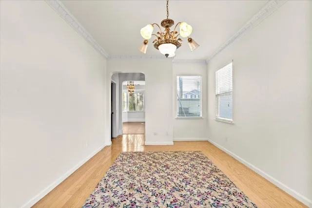 a view of a hallway with a chandelier