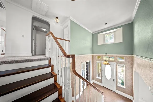 a view of an entryway with wooden floor