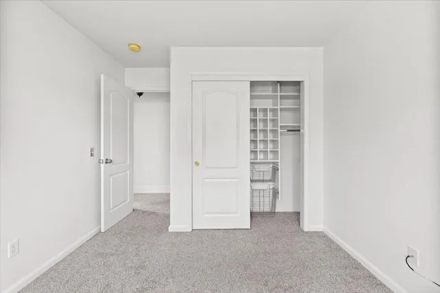 an empty room with closet and closet