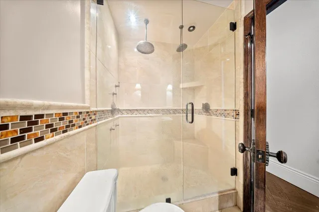a bathroom with a bathtub and shower