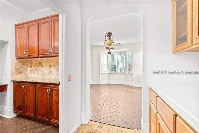 a view of an entryway with wooden floor