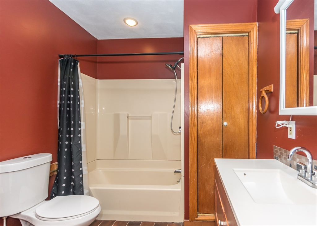 17 Cleveland Avenue, Unit 1 Everett, MA 02149 - Photo 14 of 20 a bathroom with a sink a toilet and shower