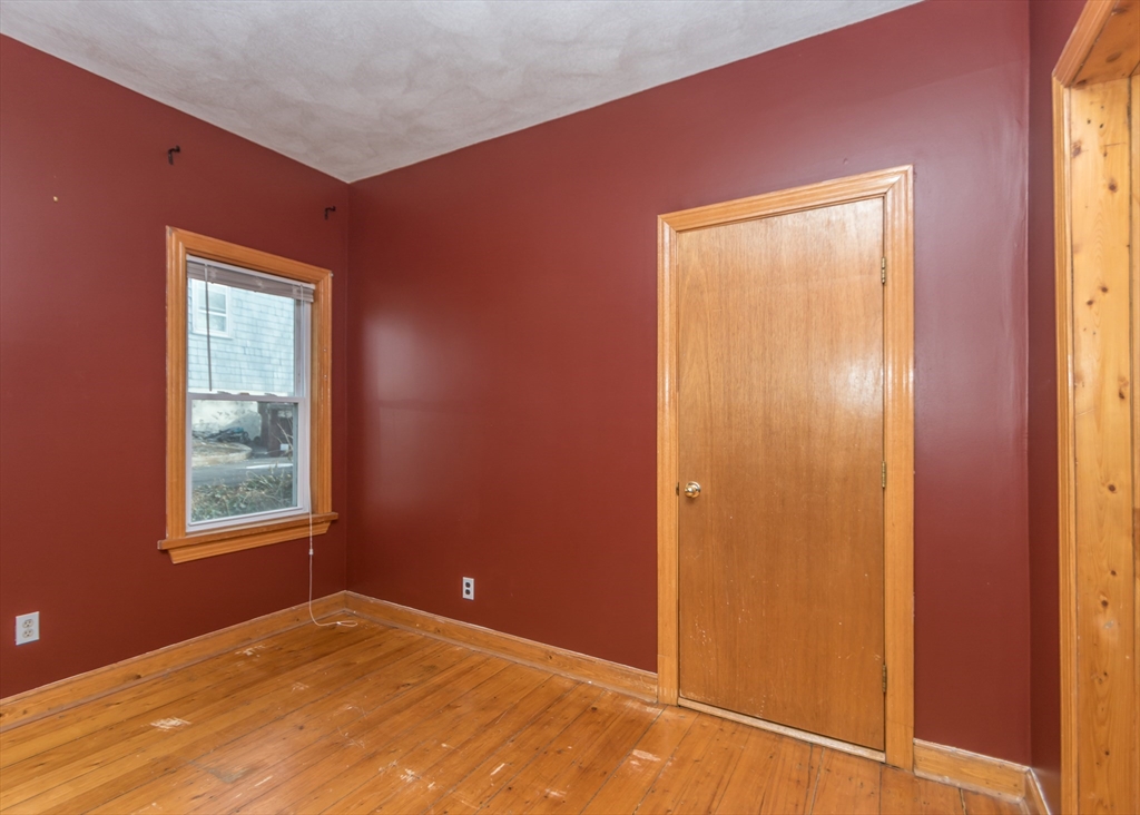 17 Cleveland Avenue, Unit 1 Everett, MA 02149 - Photo 17 of 20 an empty room with windows and closet