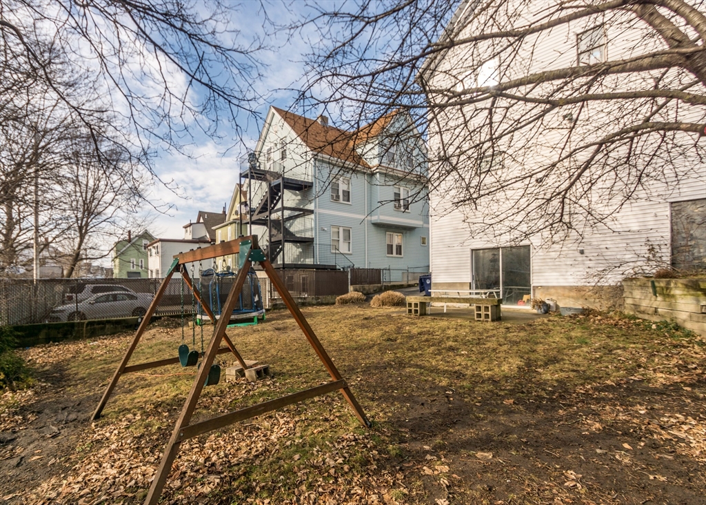17 Cleveland Avenue, Unit 1 Everett, MA 02149 - Photo 20 of 20 a house with trees in the background