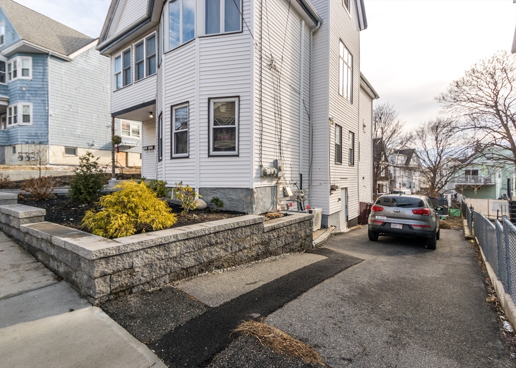 17 Cleveland Avenue, Unit 1 Everett, MA 02149 - Photo 4 of 20 a view of a car park in front of a building