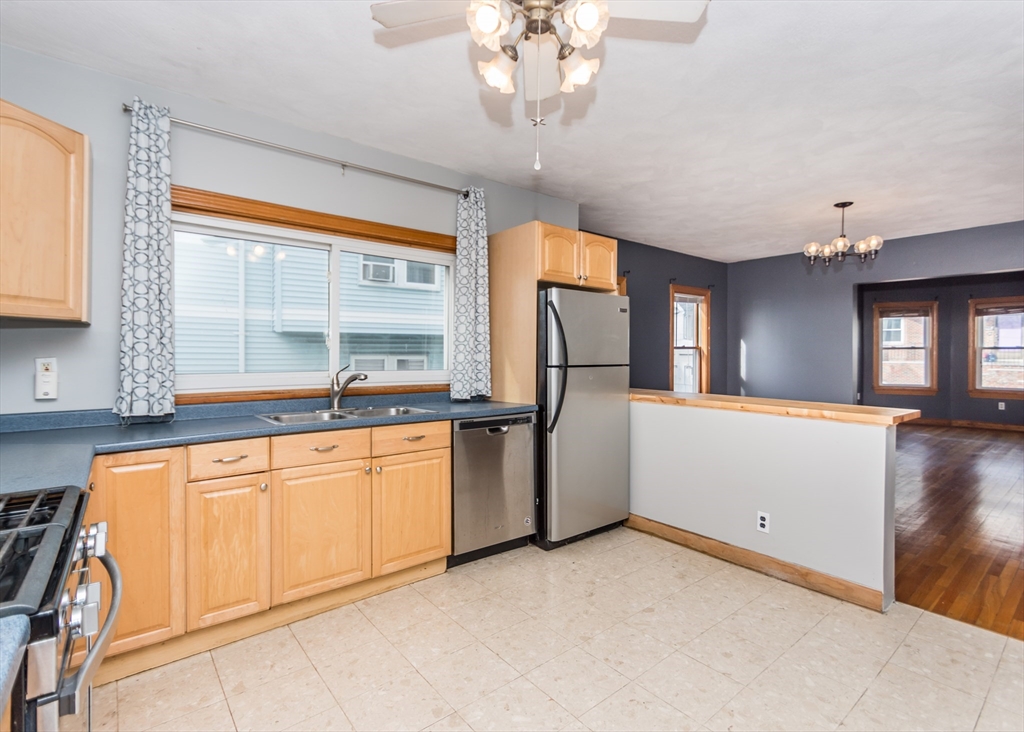 17 Cleveland Avenue, Unit 1 Everett, MA 02149 - Photo 6 of 20 a kitchen with refrigerator and window