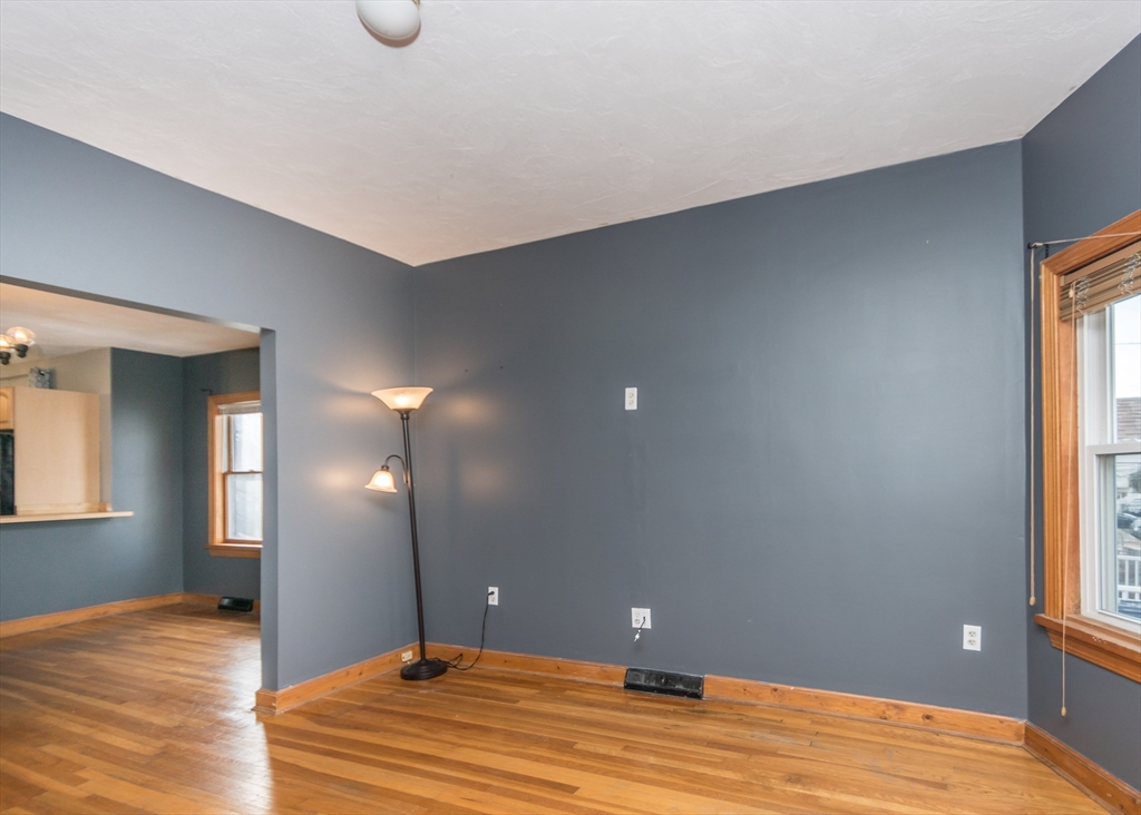 17 Cleveland Avenue, Unit 1 Everett, MA 02149 - Photo 9 of 20 a view of a room with wooden floor and windows