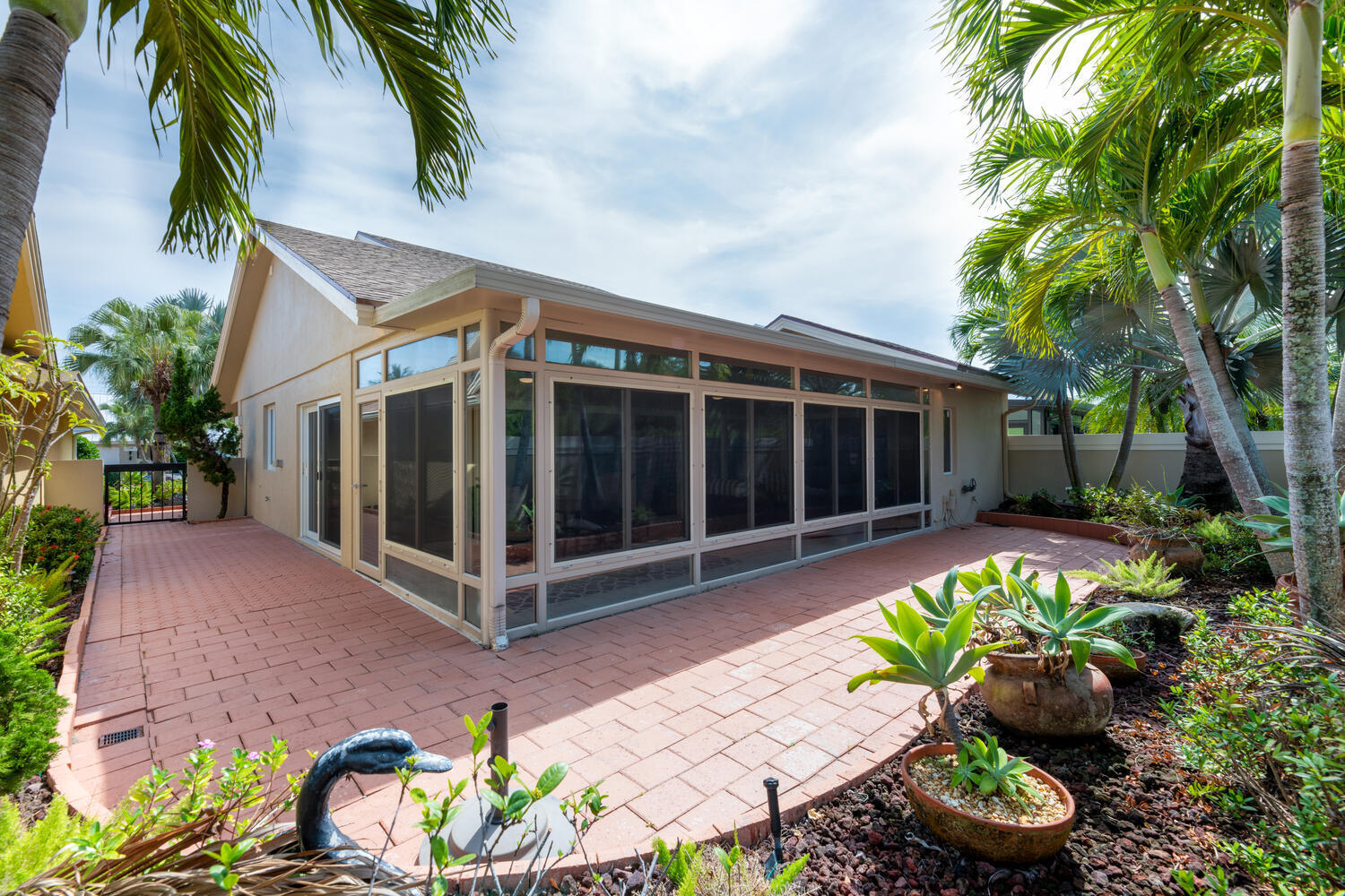 108 Seashore Drive Jupiter, FL 33477 - Photo 25 of 42 a view of a house with a yard