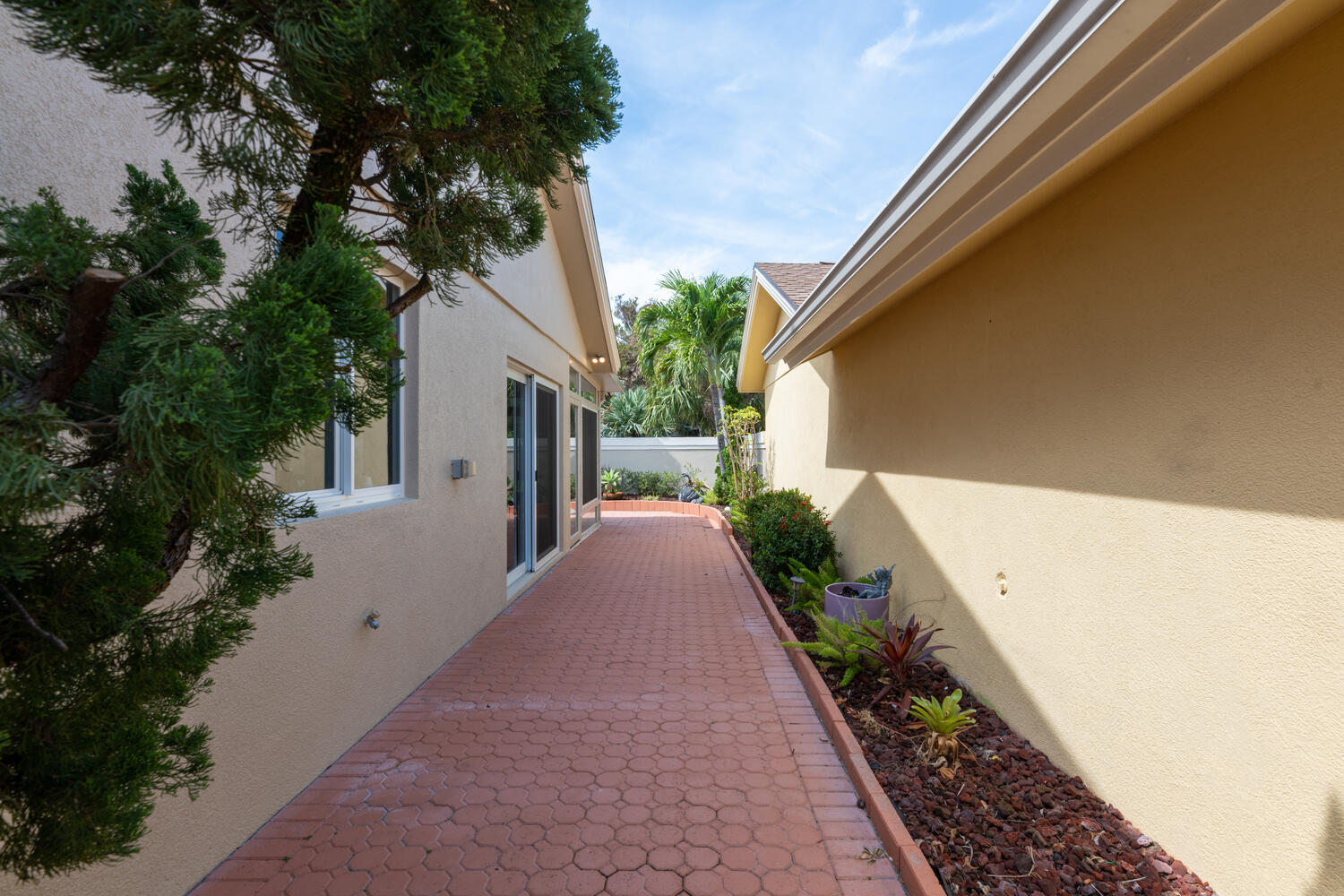 108 Seashore Drive Jupiter, FL 33477 - Photo 27 of 42 a front view of a house with a yard