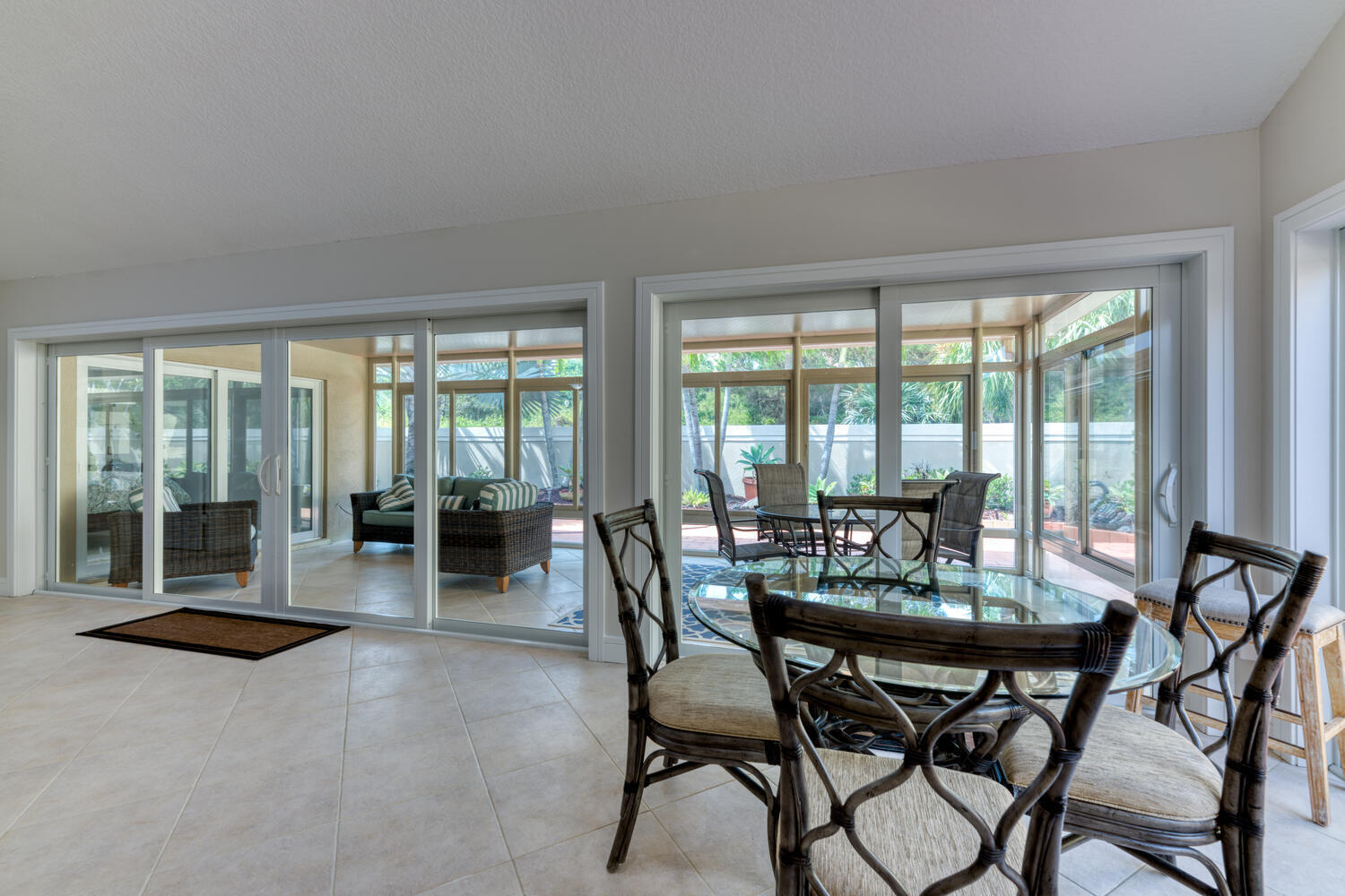 108 Seashore Drive Jupiter, FL 33477 - Photo 9 of 42 a dining room with furniture and floor to ceiling windows