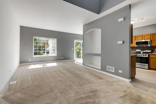 a view of an empty room with a window