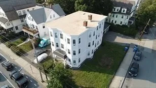 a view of multiple houses with a yard