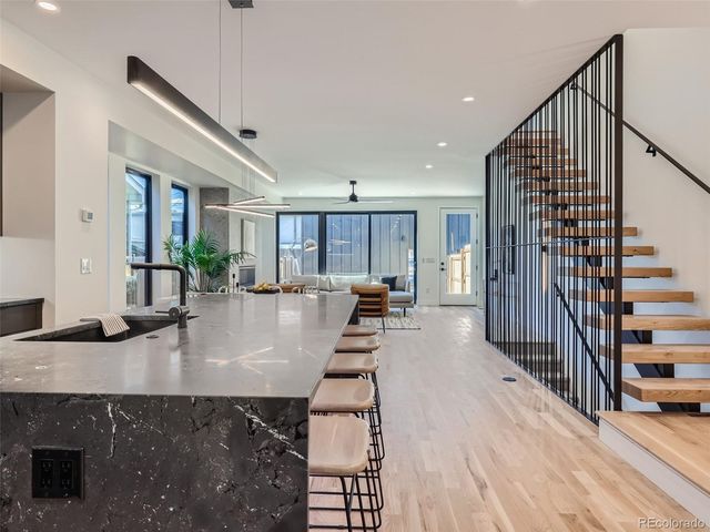a view of kitchen with furniture and counter top