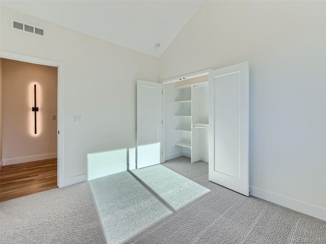 a view of a room with window and closet