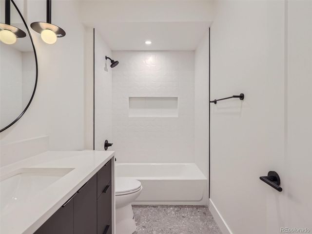 an empty room with a ceiling fan and a window