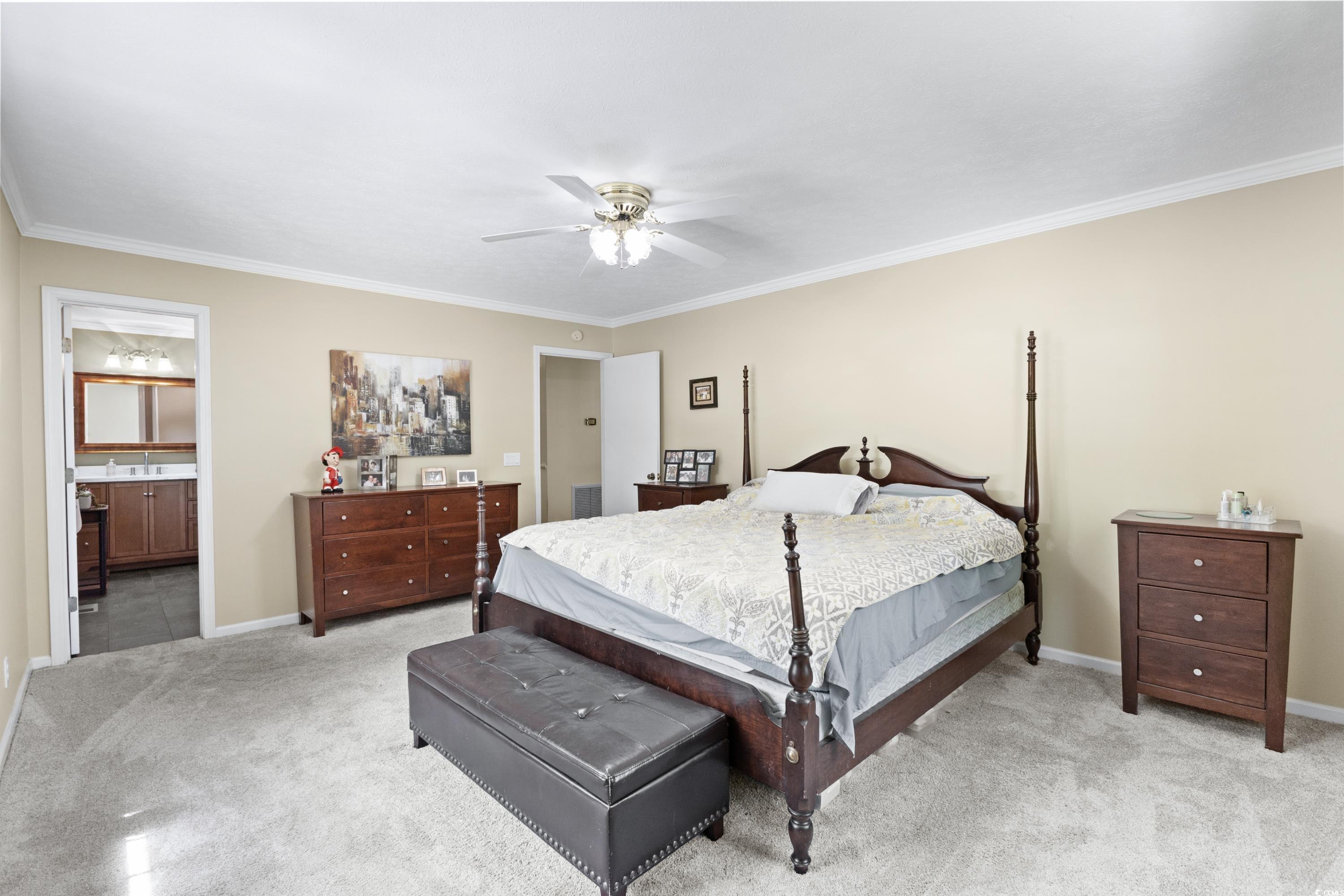 1869 Meadowood Lane Longs, SC 29568 - Photo 12 of 37 Bedroom with light carpet, baseboards, and ornamental molding