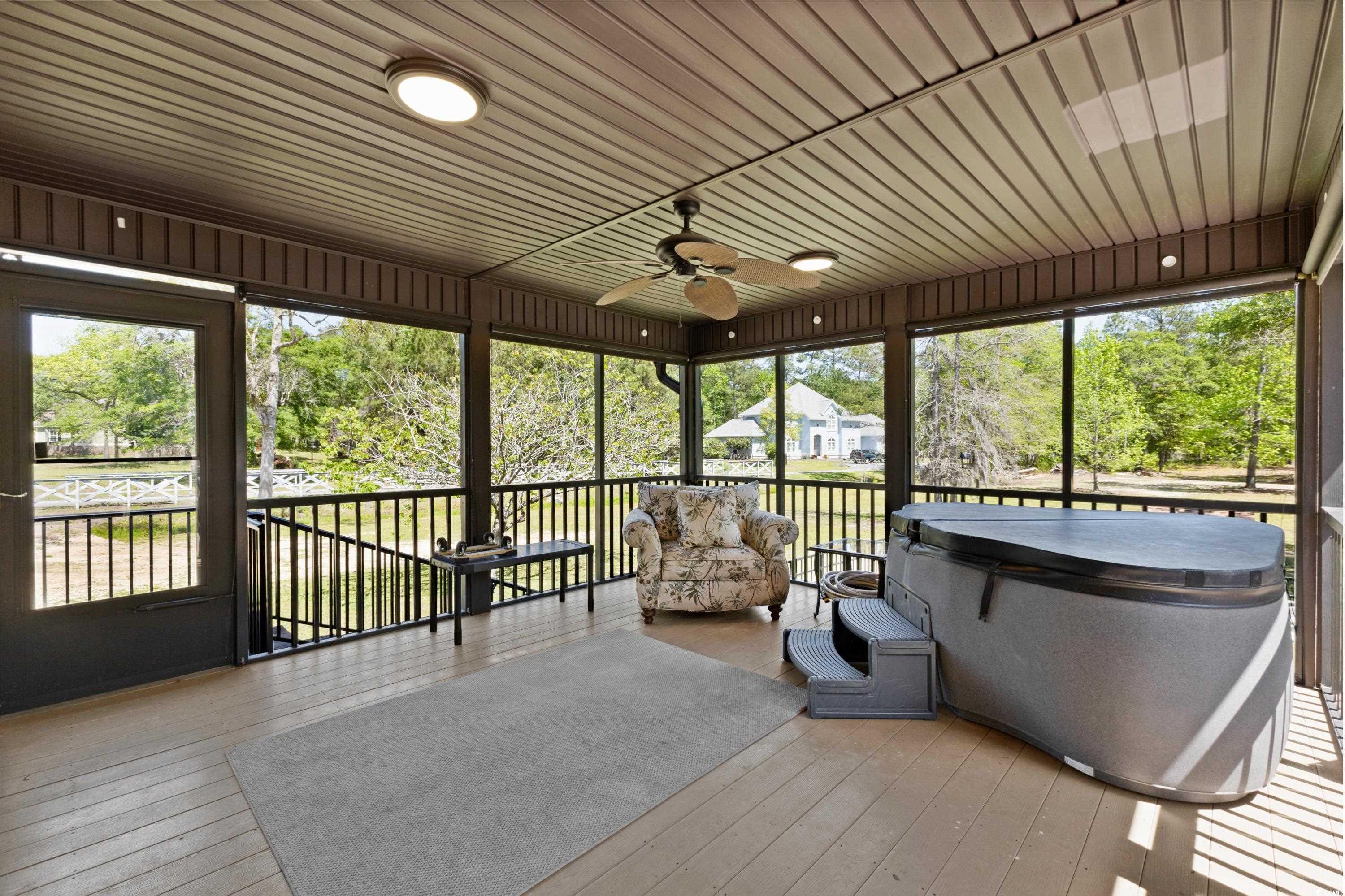 1869 Meadowood Lane Longs, SC 29568 - Photo 24 of 37 Sunroom featuring a jacuzzi, a wealth of natural light, and ceiling fan