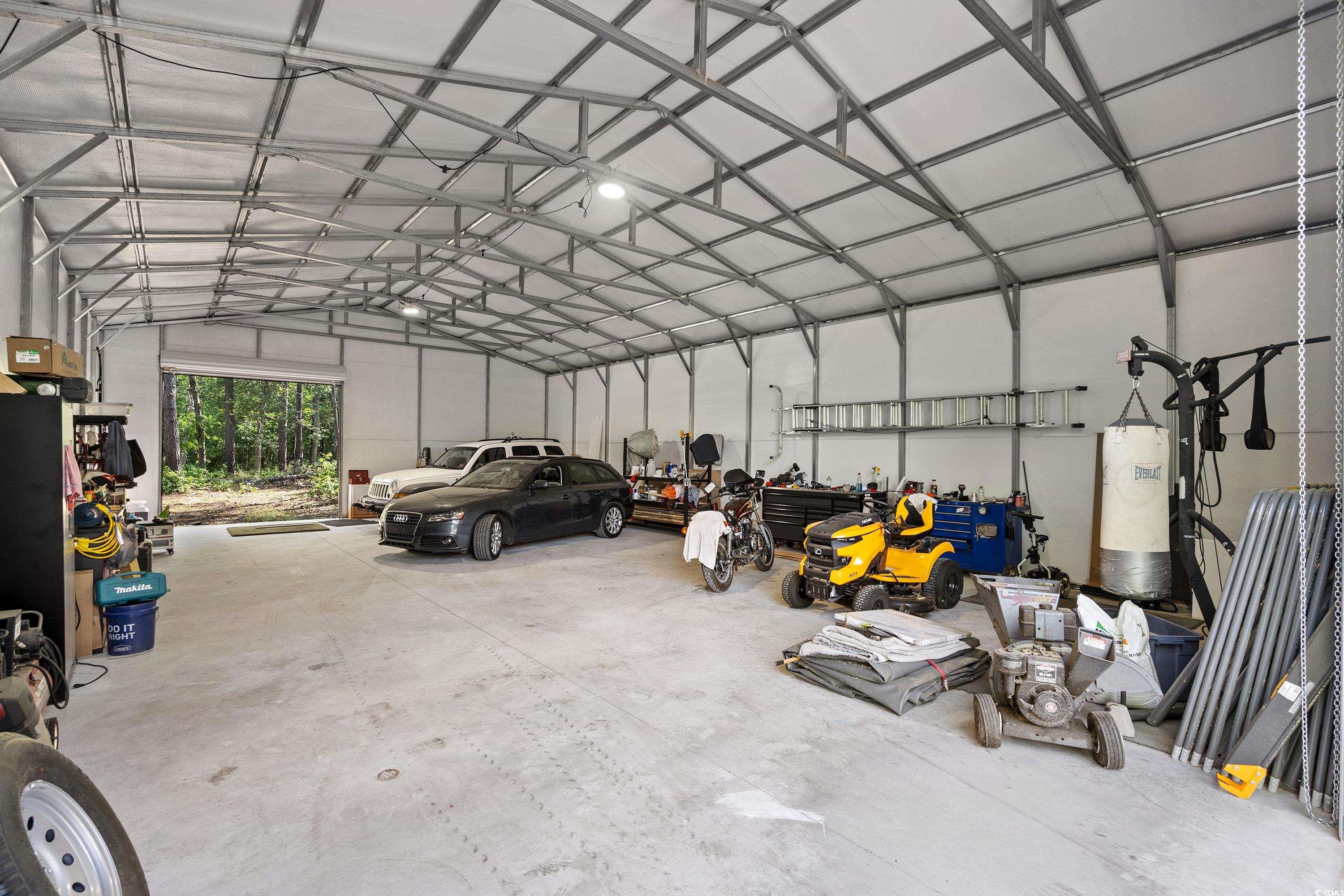 1869 Meadowood Lane Longs, SC 29568 - Photo 3 of 37 Garage featuring water heater