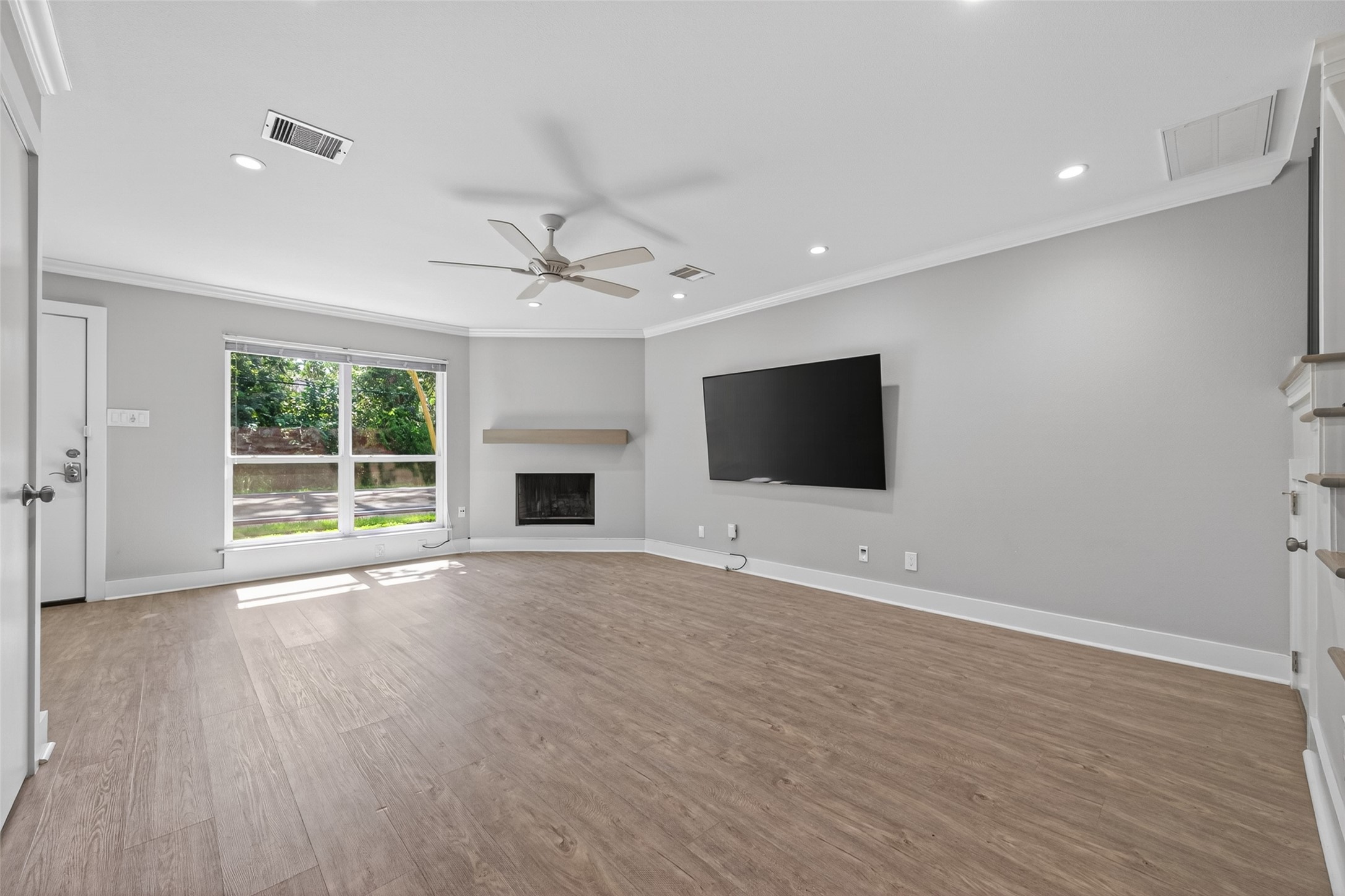 1805 Witte Road, Unit 3 Houston, TX 77080 - Photo 6 of 33 a view of an empty room with wooden floor and a window