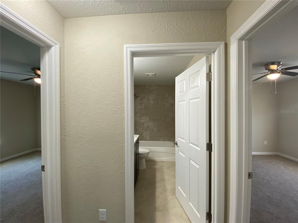 16767 Southwest 21st Terrace Road Ocala, FL 34473 - Photo 16 of 30 a view of a bathroom from a hallway