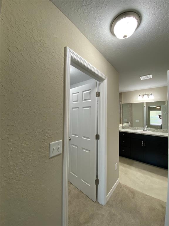 16767 Southwest 21st Terrace Road Ocala, FL 34473 - Photo 23 of 30 a spacious bathroom with a double vanity sink and a mirror