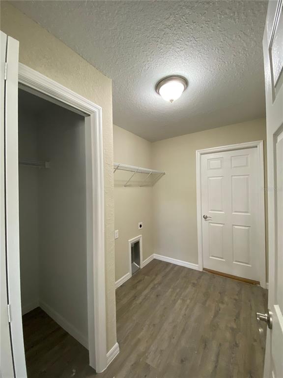 16767 Southwest 21st Terrace Road Ocala, FL 34473 - Photo 27 of 30 an empty room with closet and wooden door