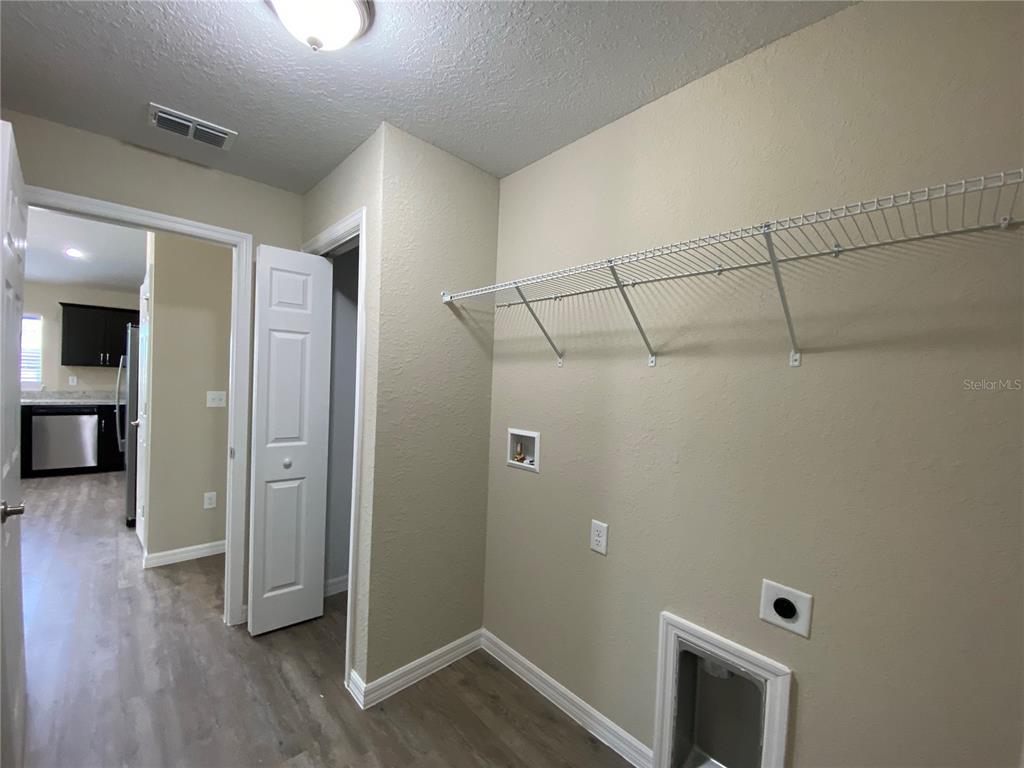 16767 Southwest 21st Terrace Road Ocala, FL 34473 - Photo 28 of 30 a view of a hallway with wooden floor