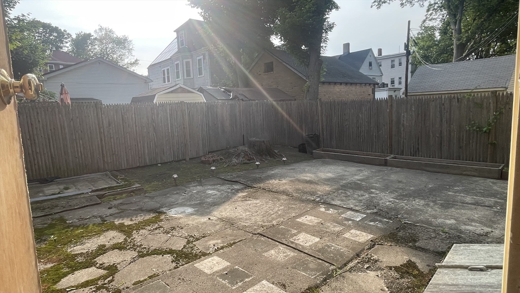 13 Whitman Street, Unit B Boston, MA 02124 - Photo 25 of 25 a backyard of a house