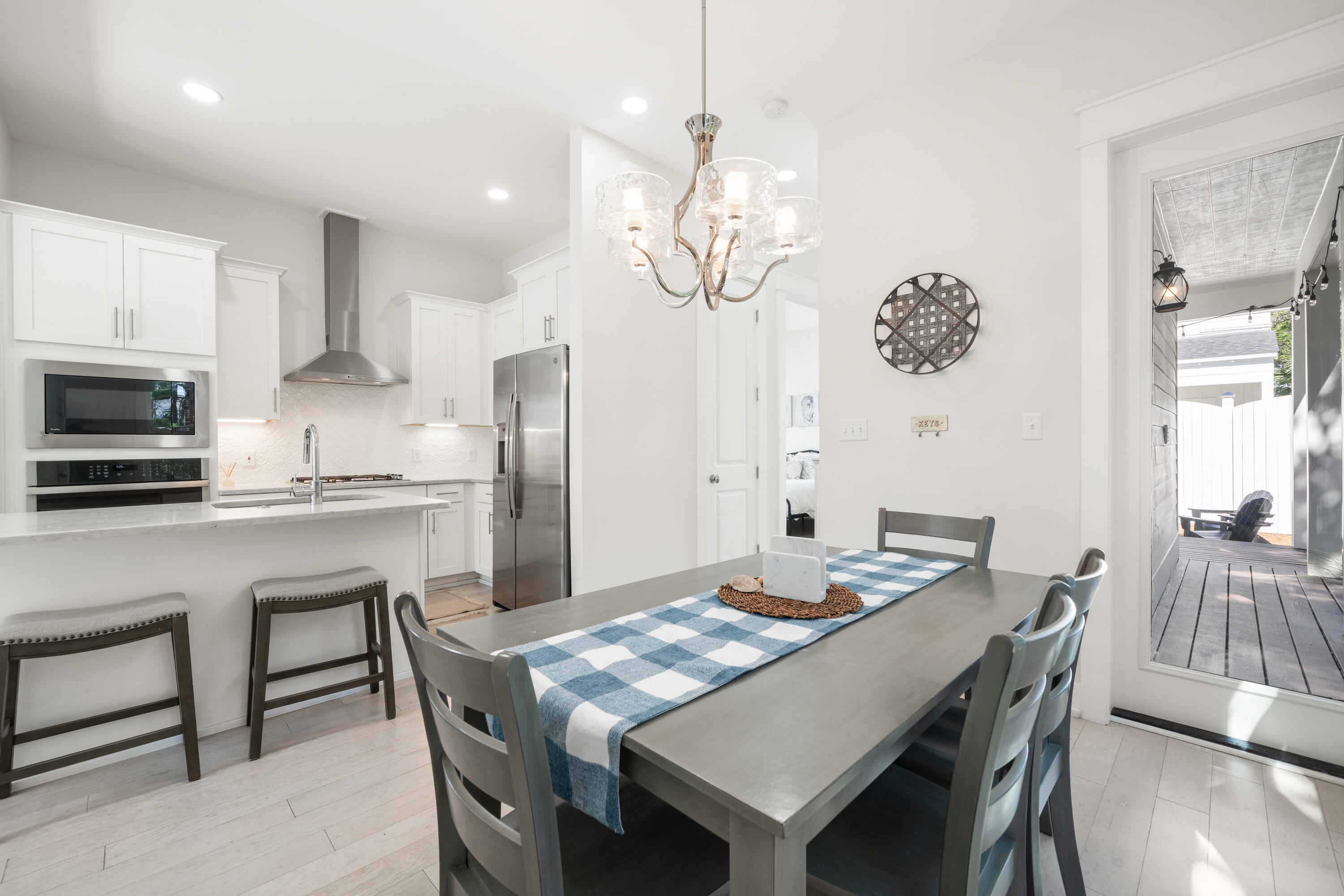 97 Beach View Drive Inlet Beach, FL 32461 - Photo 11 of 57 a view of a dining room with furniture a chandelier and wooden floor