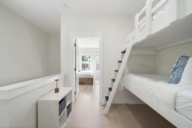 a bedroom with a bed and flat screen tv